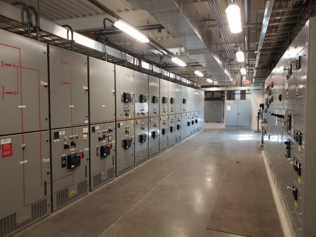 Electrical switchgear and motor control center panels inside a pump station building