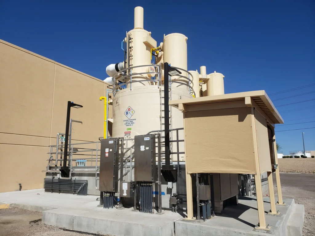 Chemical treatment storage tank and feed system outside a water treatment facility