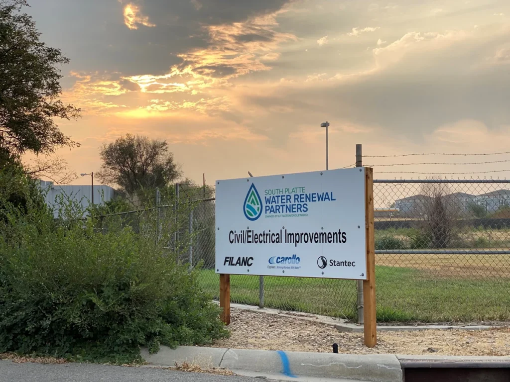 South Platte Water Renewal Partners Civil/Electrical Improvements project sign at sunset
